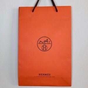 ❤️ 3/30$ 
Hermès orange paper bag 43x28x10cm